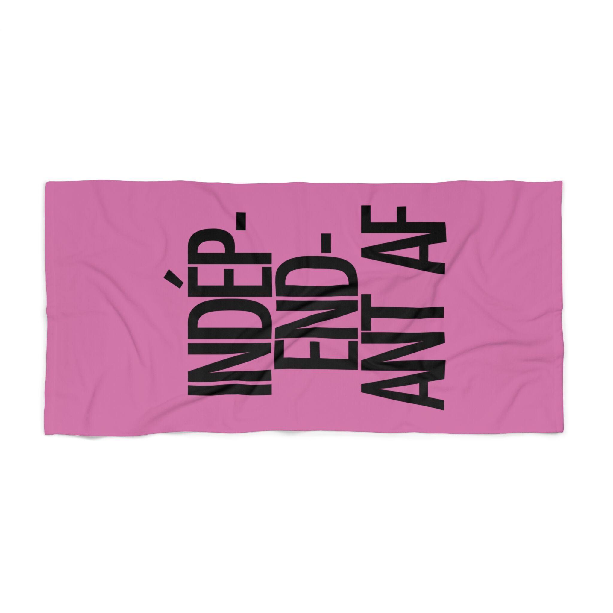 The Catherine Deneuve Would Approve Beach Towel is a pink towel featuring “INDÉPENDANT AF” printed in bold black letters—a stylish tribute to Catherine Deneuve’s legendary effortless attitude.