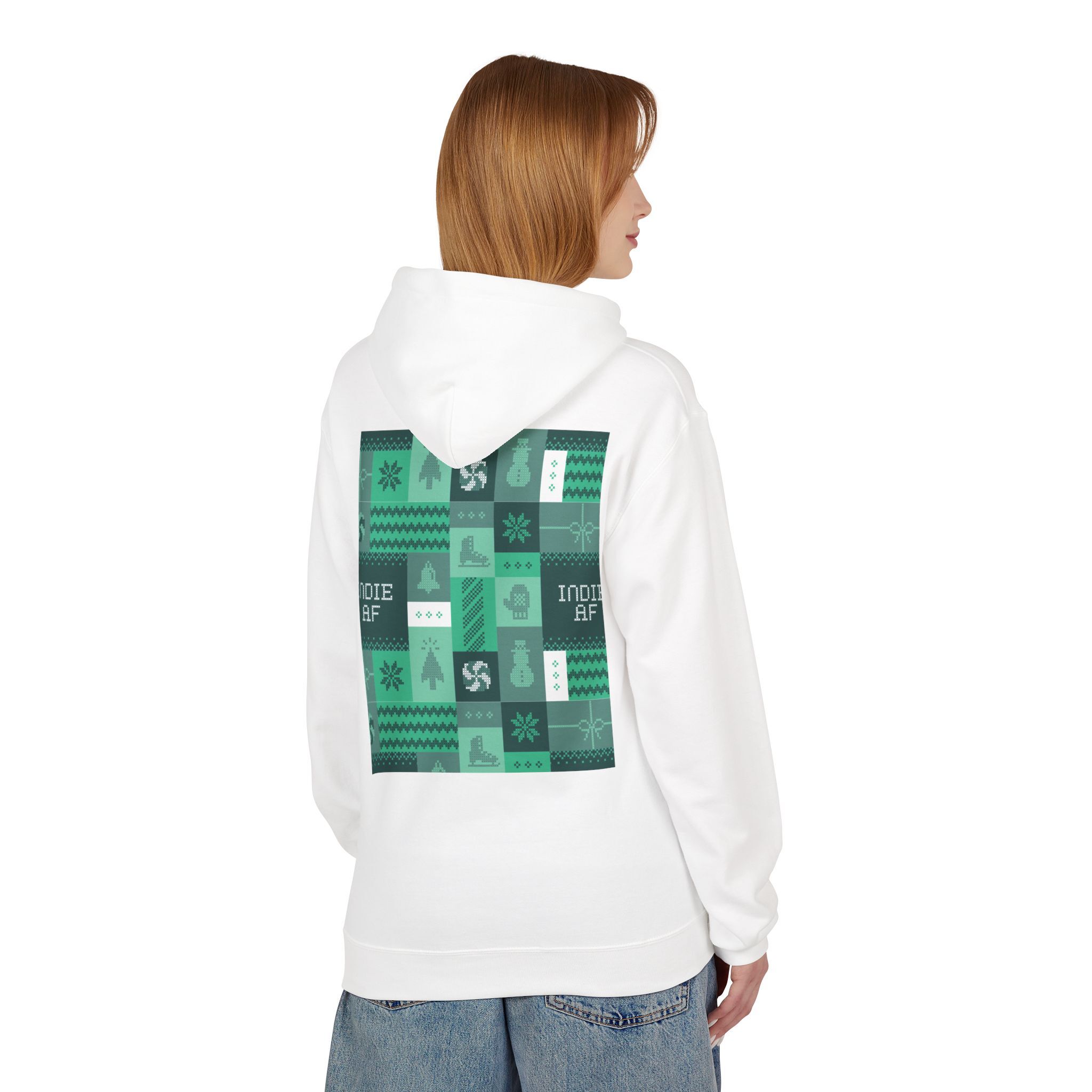 A person wearing The "Uniform Rebellion" Hoodie | Indie AF 2025 Holidays by Grown—a white hoodie with green geometric and graphic patches on the back—stands sideways, facing left.