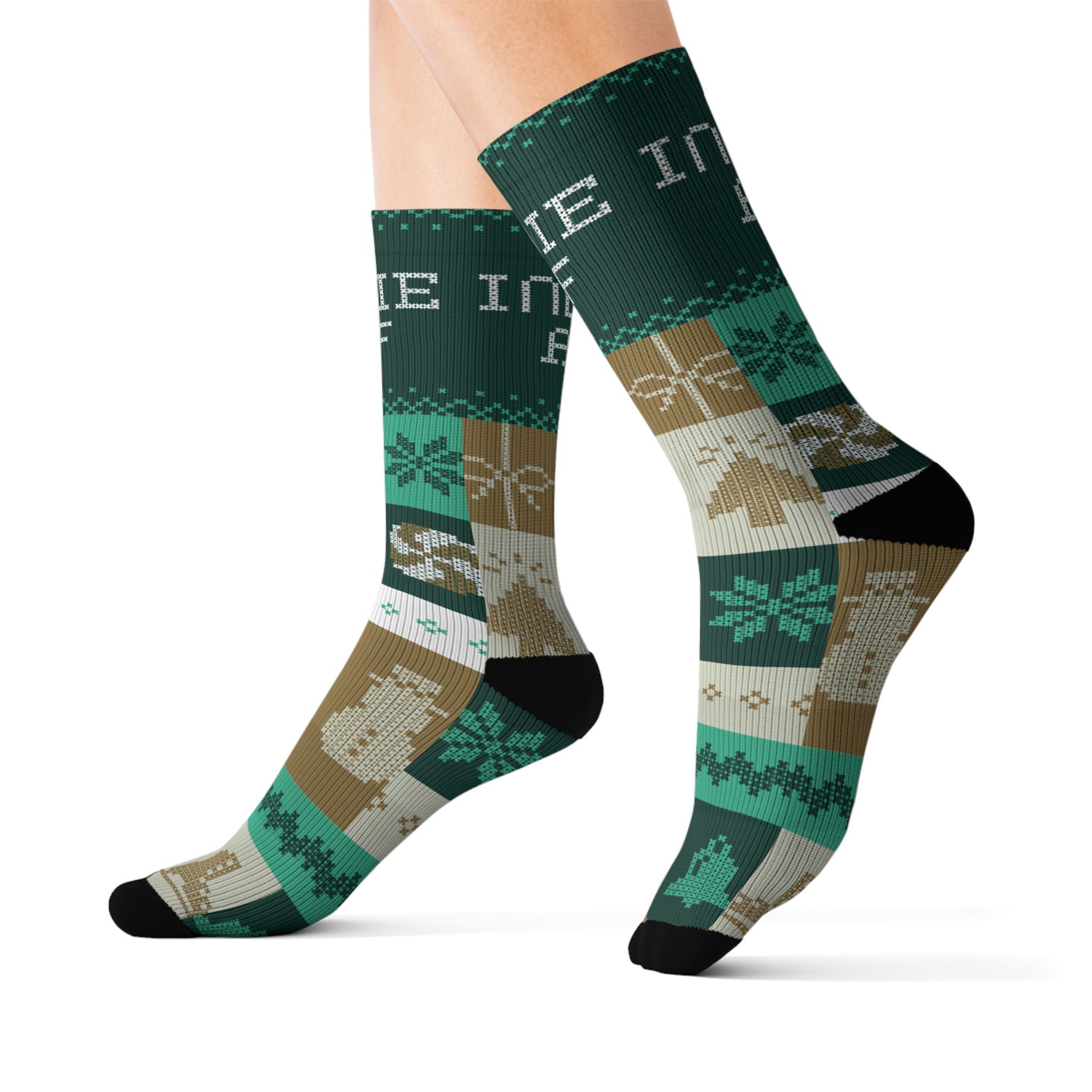 A pair of legs wearing The "Cold Feet" Socks - Gold from Indie AF 2025 Holidays by Grown—featuring knit-style cacti, animal heads, and geometric patterns for an adventurous touch.