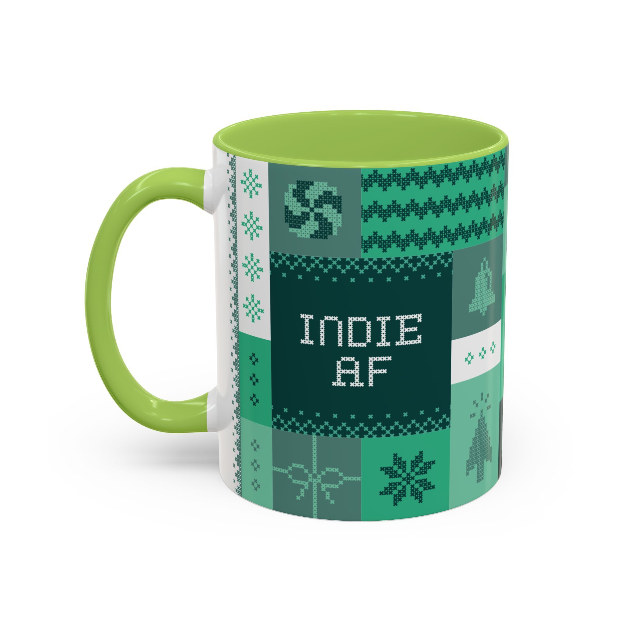 The "Mandatory Fun" Mug - Green | 11oz by Grown features a green and white ceramic design with pixel art, geometric and winter motifs, plus the phrase INDIE AF at the center. Perfect for the 2025 Holidays.