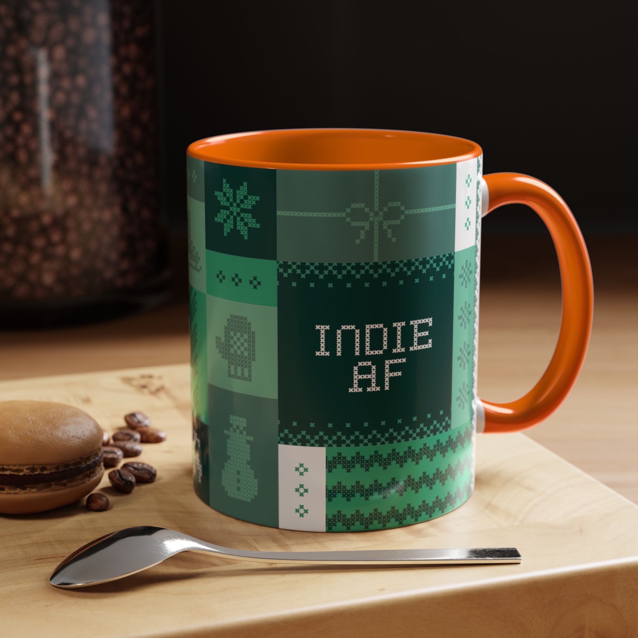 The "Mandatory Fun" Mug - Green | 11oz Indie AF 2025 Holidays by Grown features a pixel art design, perfect for adding playful vibes to your coffee break. It sits stylishly on wood beside a macaron, coffee beans, and a spoon.