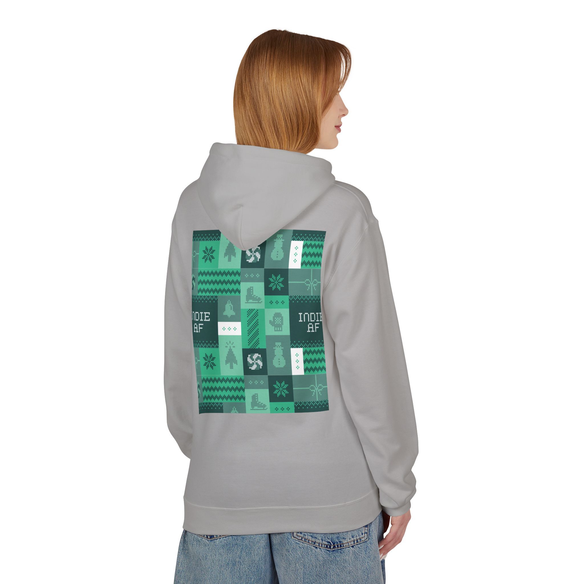 Wearing The "Uniform Rebellion" Hoodie | Indie AF 2025 Holidays by Grown, a light gray piece with a green and black geometric pattern and bold icons on the back, this person stands against a plain background exuding effortless style.