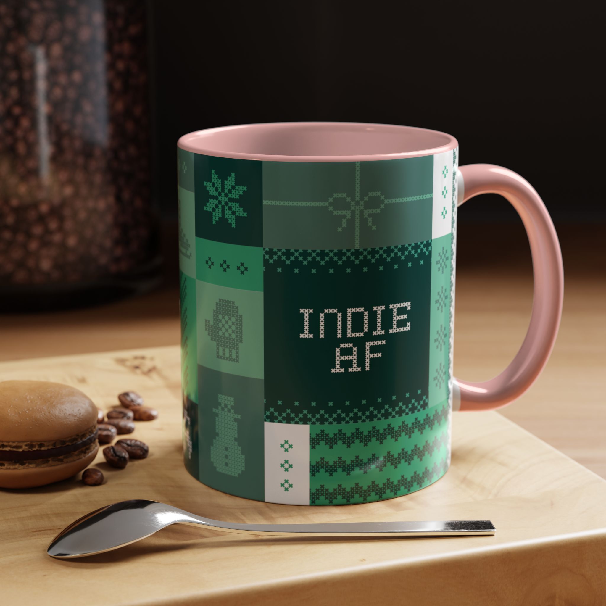 The "Mandatory Fun" Mug - Green | 11oz Indie AF 2025 Holidays by Grown features green and pink pixel art with INDIE AF 2025—ideal for sipping coffee in festive style beside treats and friends this holiday season.
