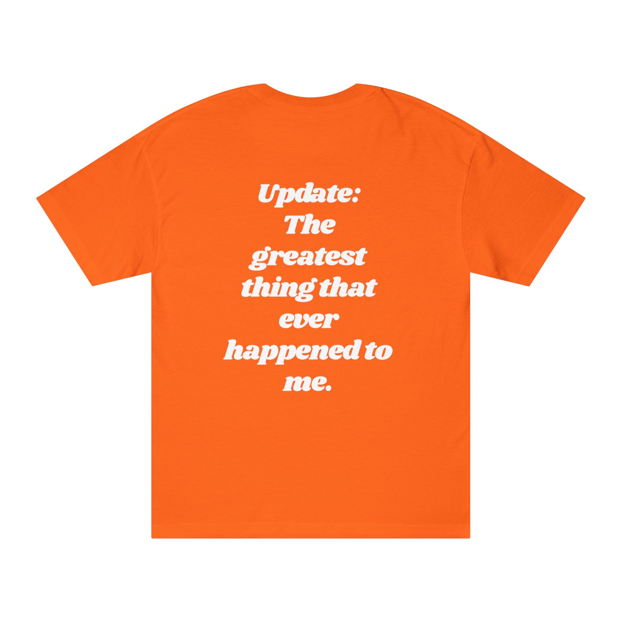 The "Update: Greatest Thing Ever" Tee is an orange graphic shirt featuring white text on the back that reads: Update: The Greatest Thing Ever happened to me.