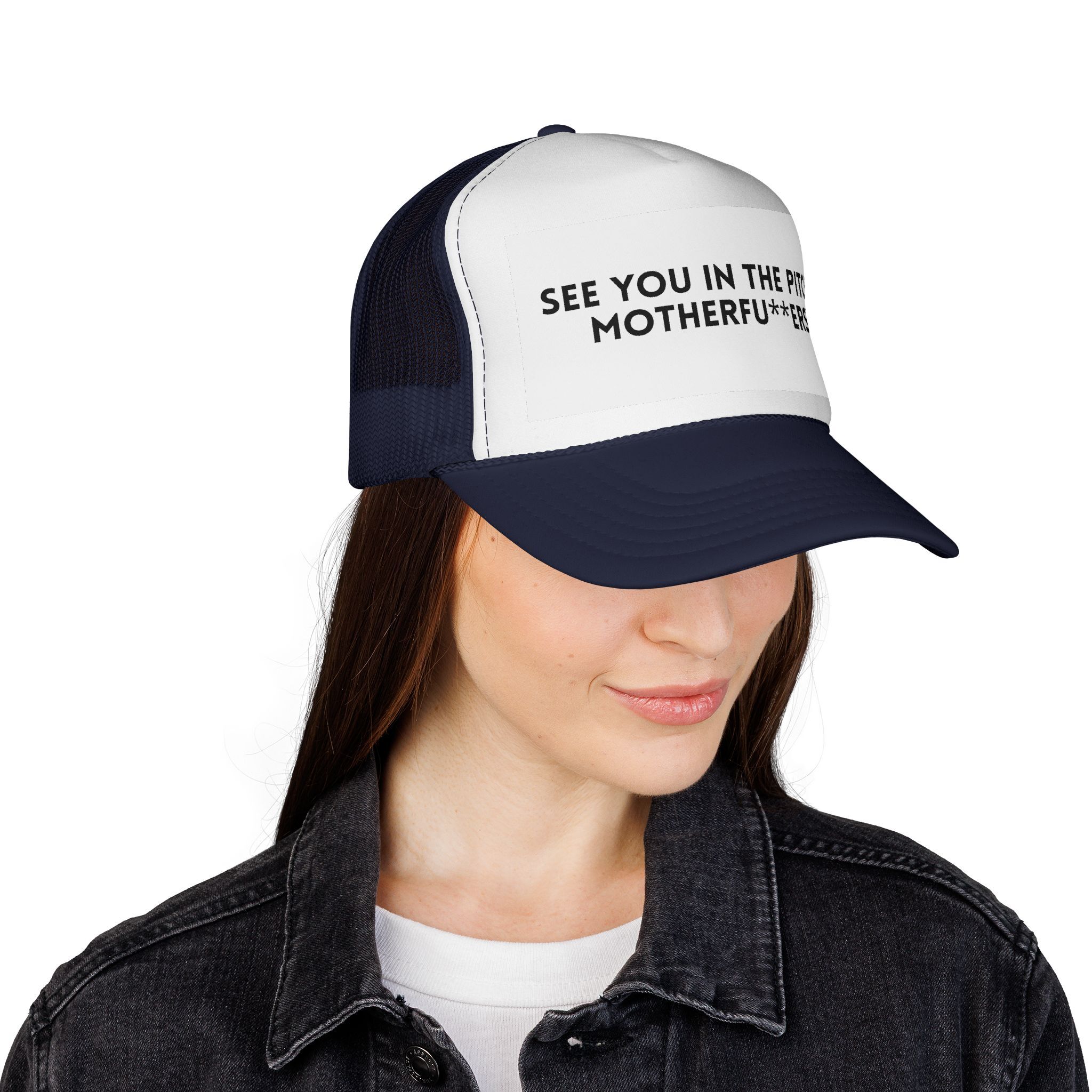 A woman wearing a black denim jacket and The "See You in the Pitch, Motherfu**ers!" Trucker Hat.