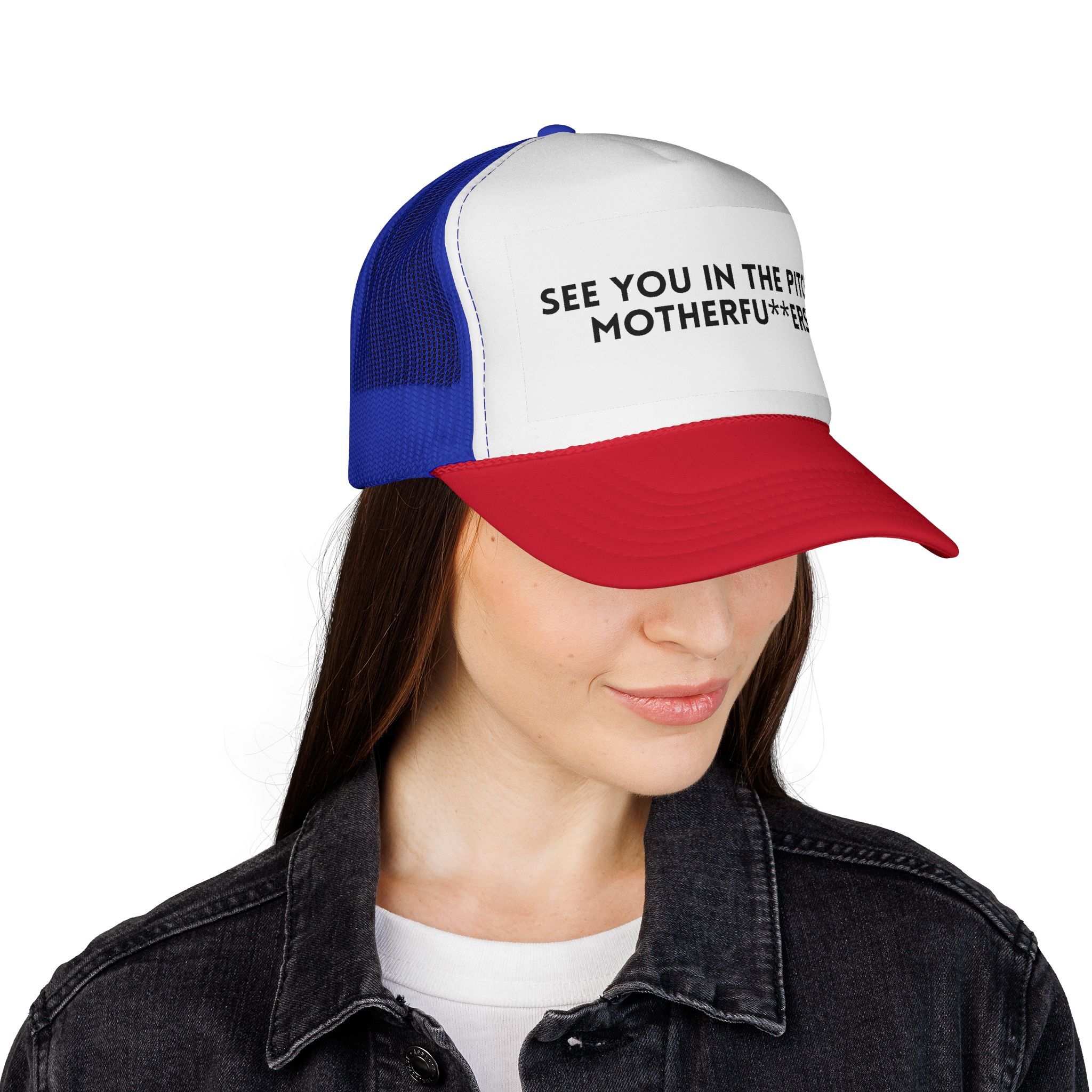 A woman wears The "See You in the Pitch, Motherfu**ers!" Trucker Hat, featuring a red, white, and blue design with the bold phrase partially visible on the front.
