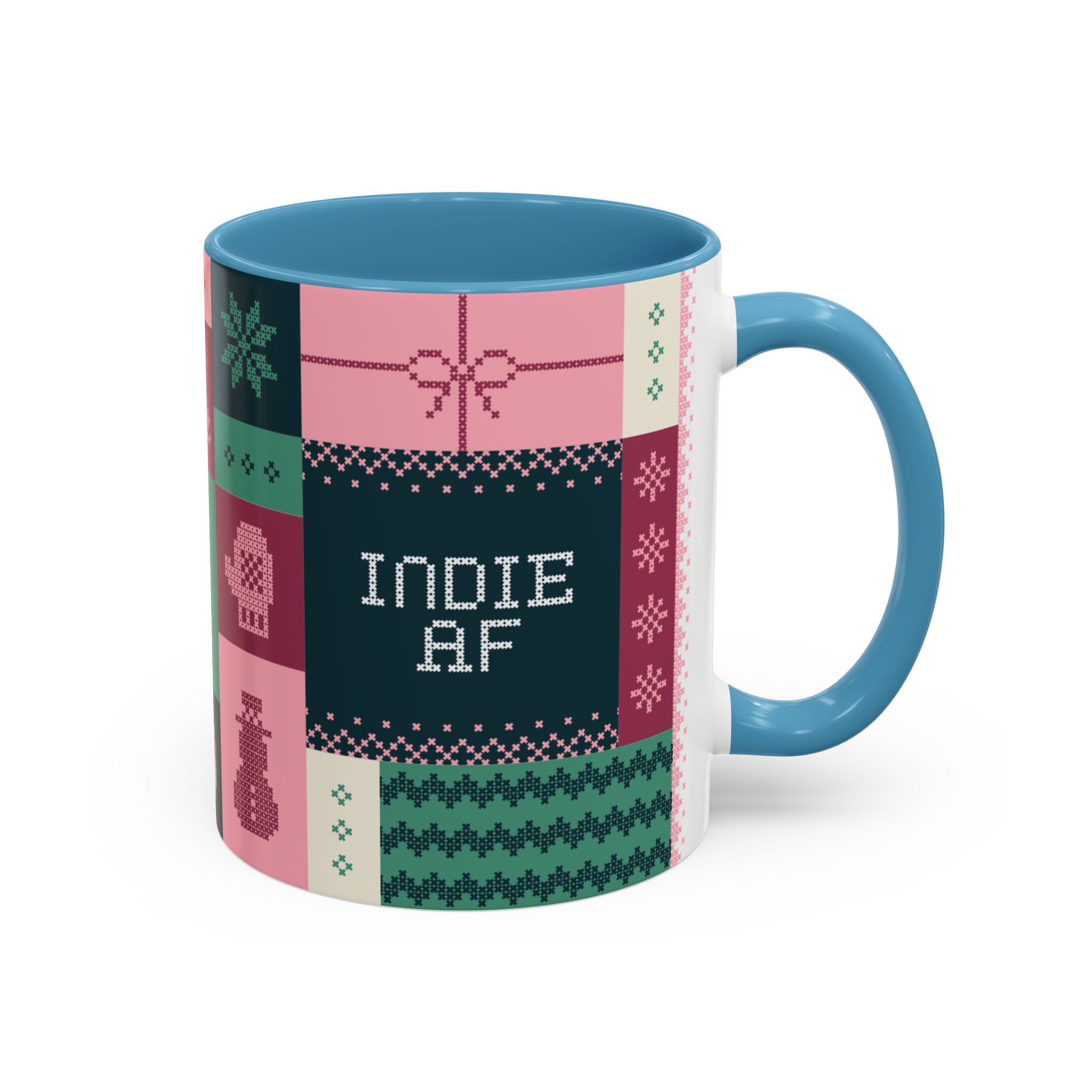 The "Mandatory Fun" Mug - Pink | 11oz by Grown features bold “INDIE AF” text and a festive patchwork design—perfect for celebrating the 2025 Holidays in style.