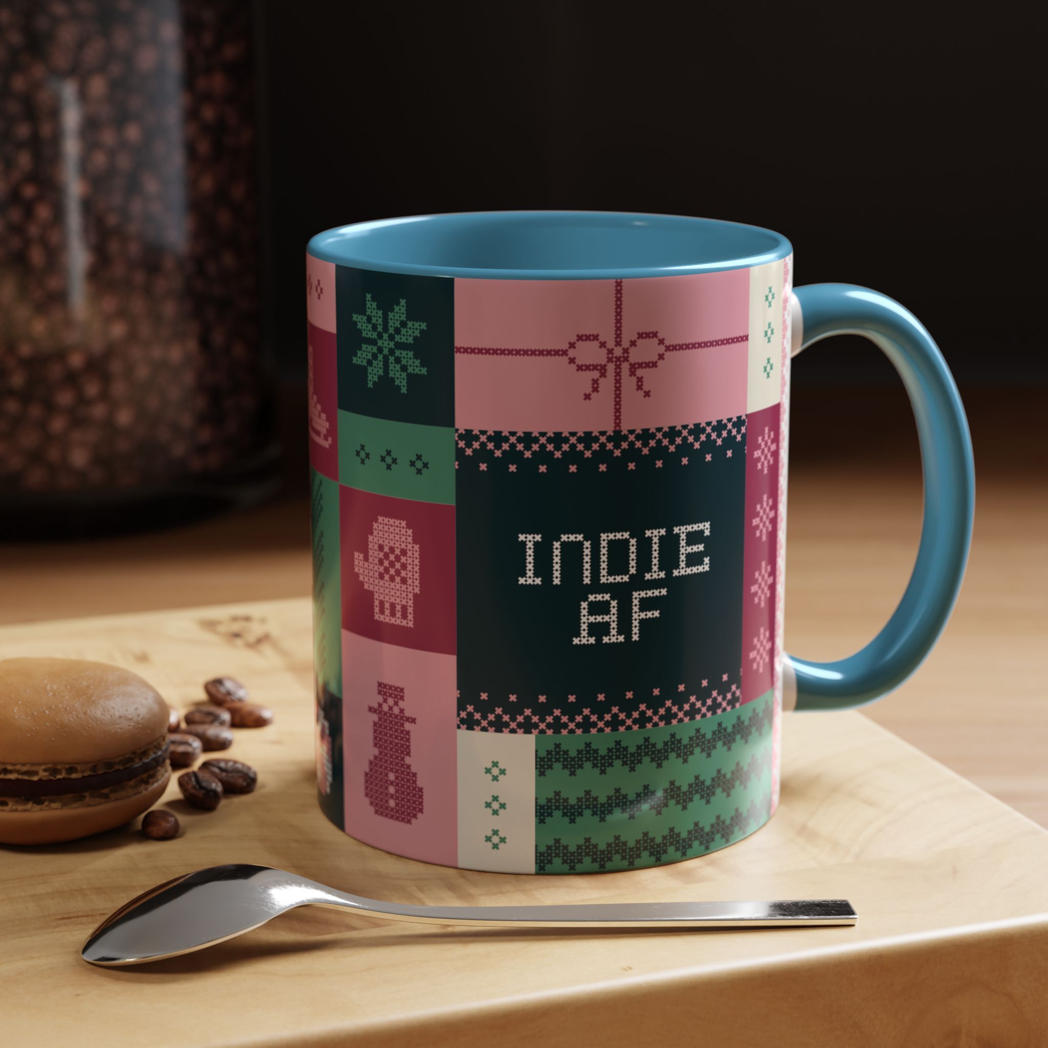 The "Mandatory Fun" Mug - Pink | 11oz Indie AF 2025 Holidays by Grown sits on a wooden tray beside a macaron, coffee beans, and a metal spoon.