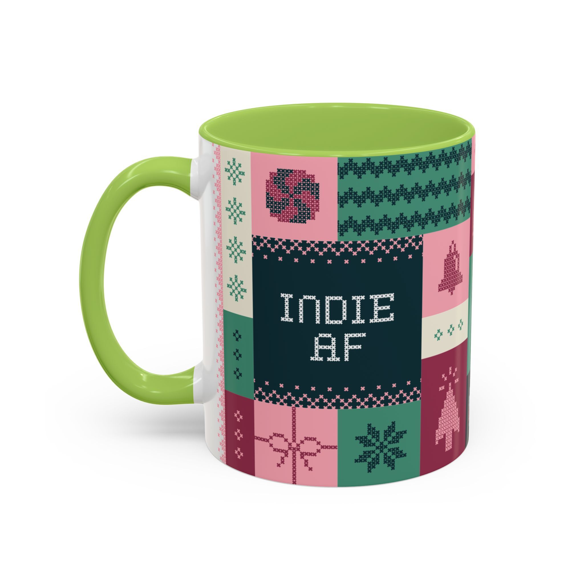 A pink 11oz mug featuring INDIE AF in pixelated lettering and a patchwork-style design—The "Mandatory Fun" Mug by Grown, perfect for your 2025 Holidays.