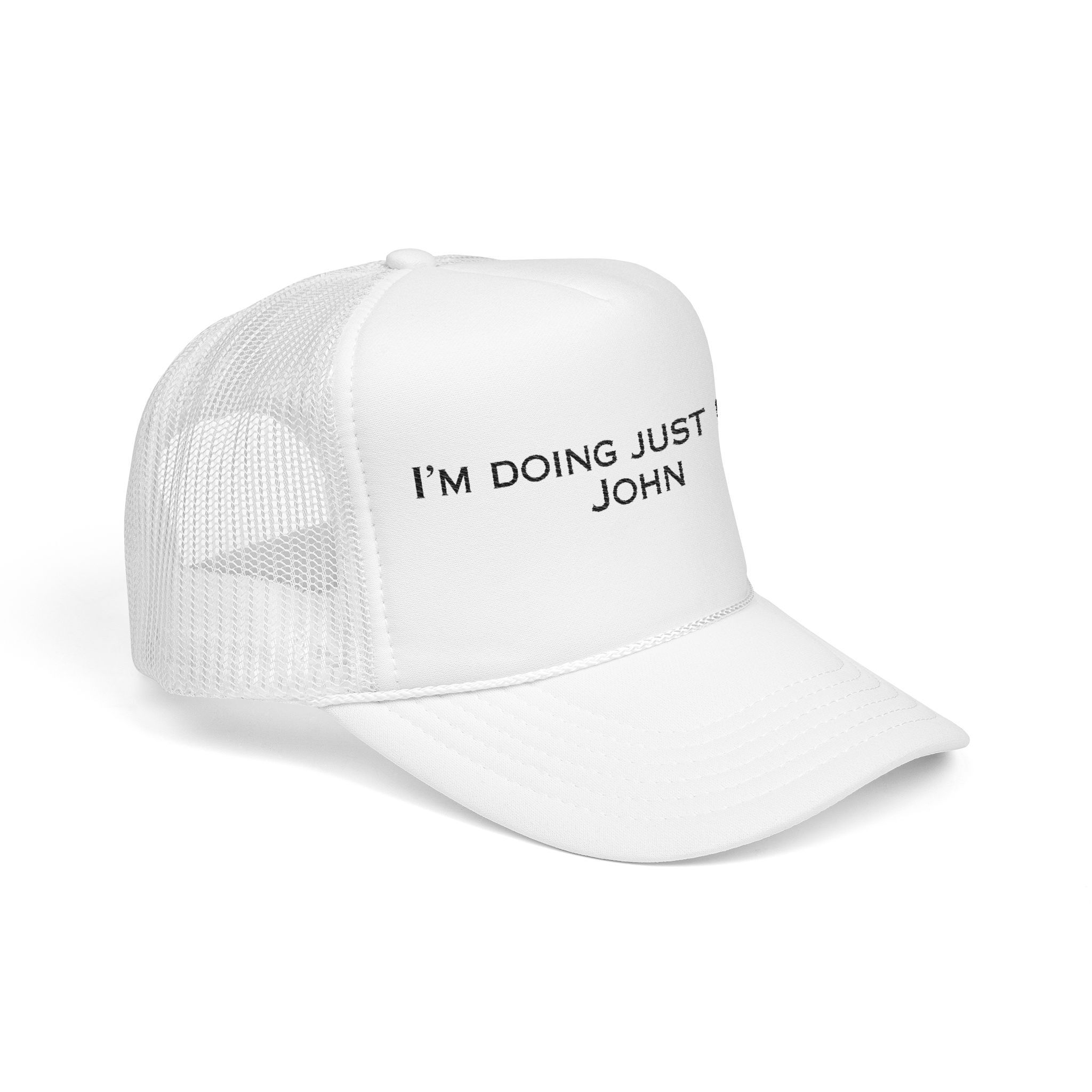 The "I'm Doing Just Fine, John" Trucker Hat features black text on a white mesh front and is available in light color options.