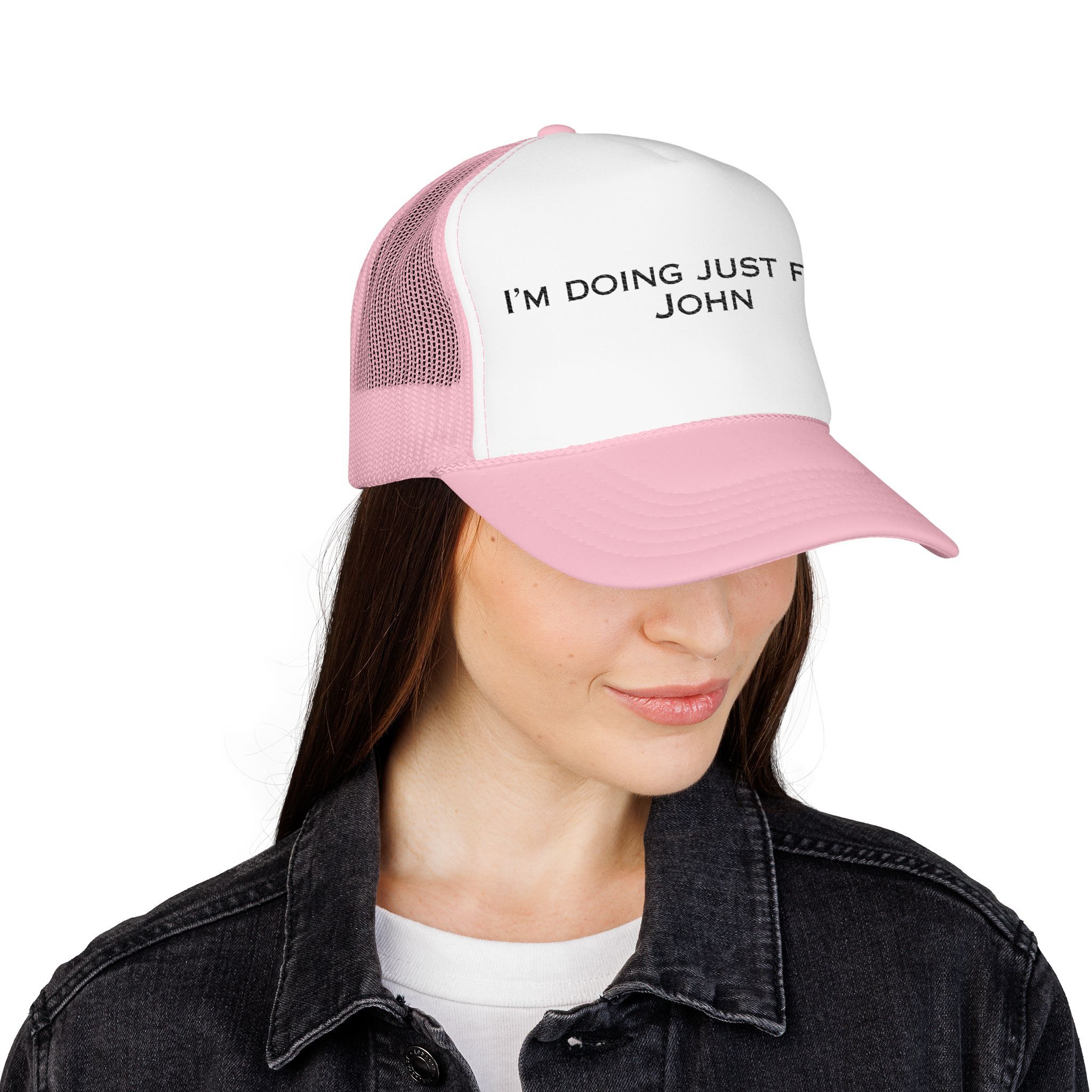 Someone is wearing The "I'm Doing Just Fine, John" Trucker Hat (light color options) with part of the phrase visible on the front.