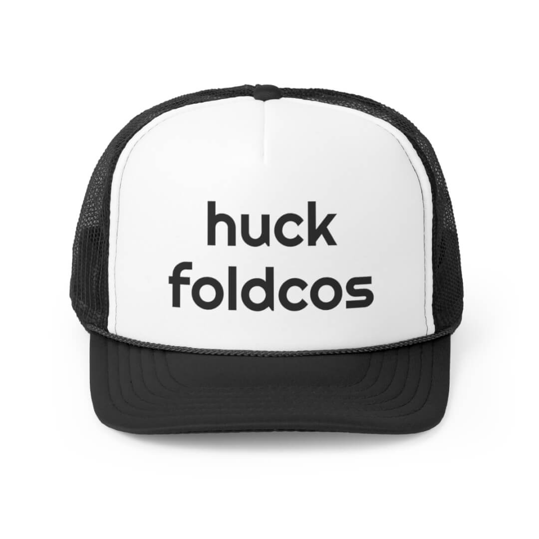 The Foldcos Trucker Hat is a black and white cap with “huck foldcos” boldly printed in black on the front panel.