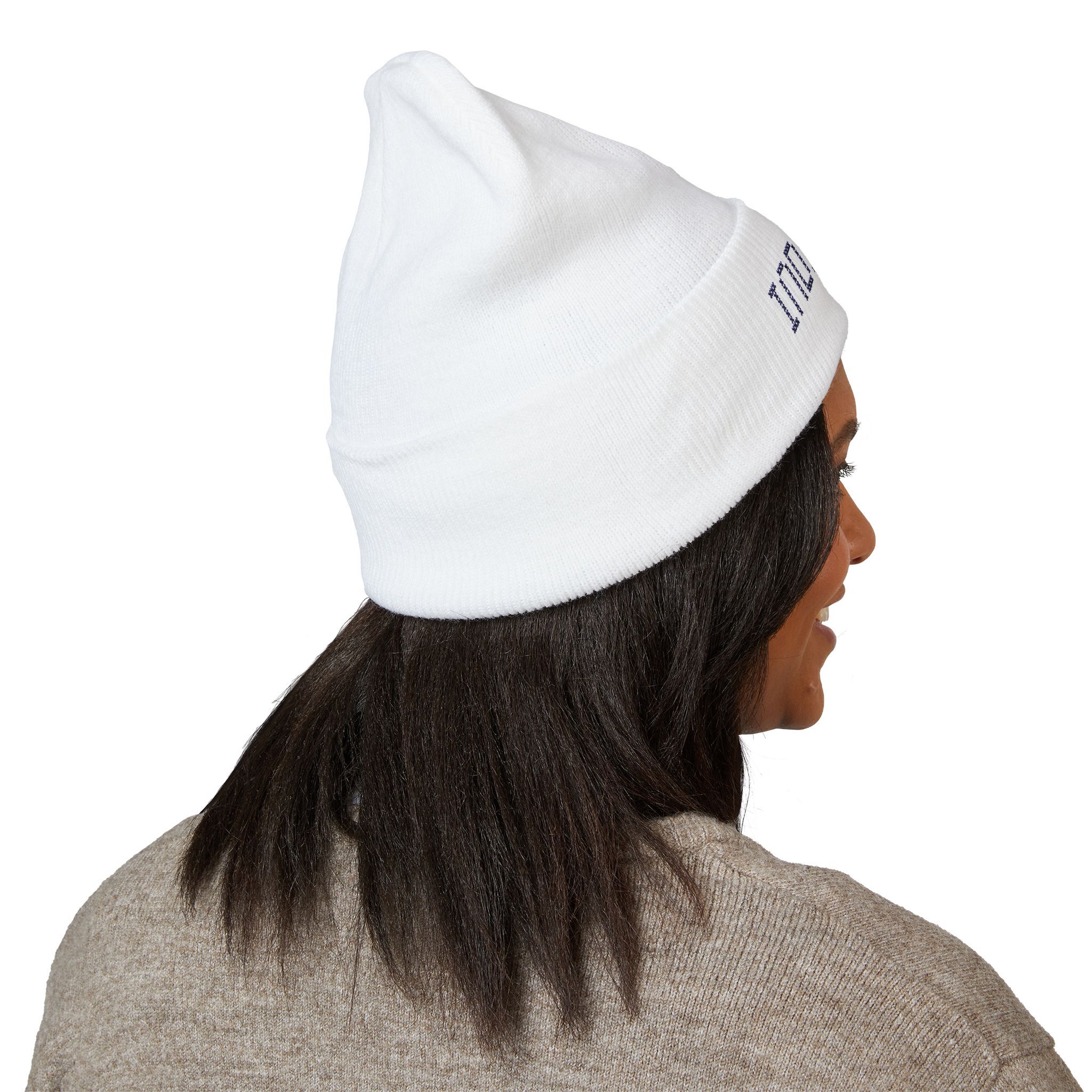 Person wearing the Indie AF 2025 Holidays by Grown cuffed beanie with dark embroidery and a beige sweater, shown from the back and slightly to the side. This look adds an indie vibe to your holiday style.